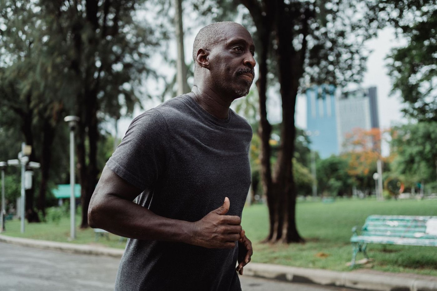A man jogging in a city park